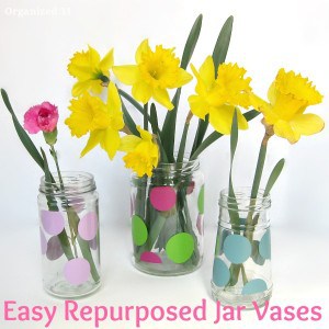 glass jars with polka dots and yellow fresh flowers with title text reading Easy Repurposed Jar Vases