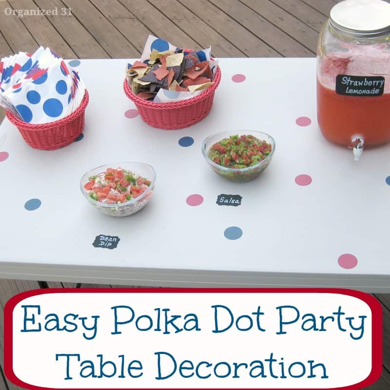 white table decorated with blue and red polka dots.
