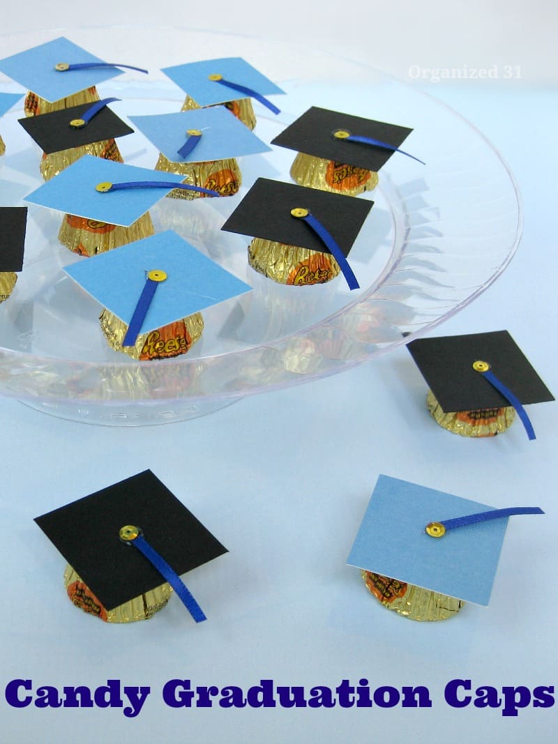 overhead view of tops of blue and black graduation caps made from candy and craft paper