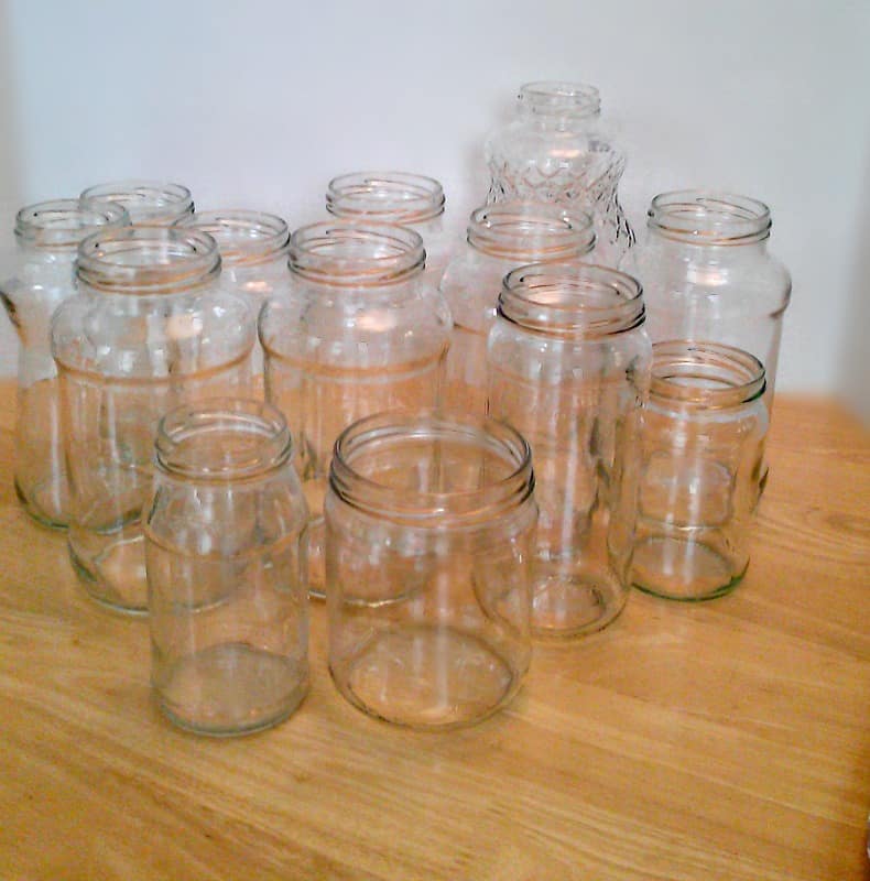 bunch of glass jars on wood table