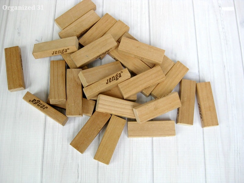 pile of wood game blocks on white wood table