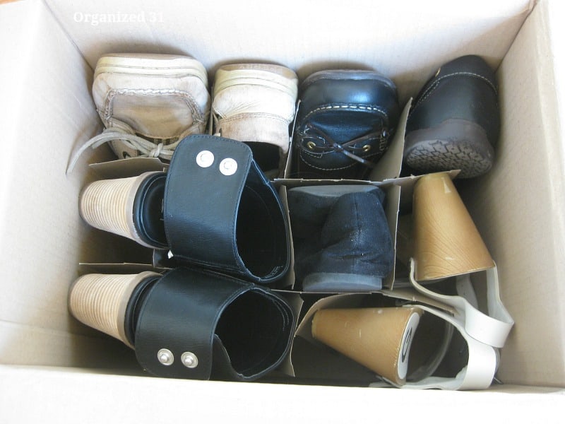 overhead look at shoes slipped into dividers in box.