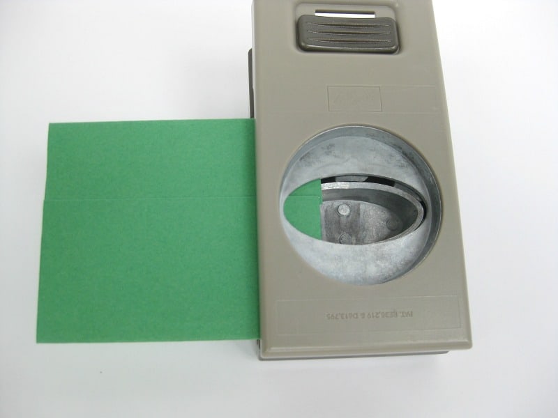 paper punch with oval shape and green paper