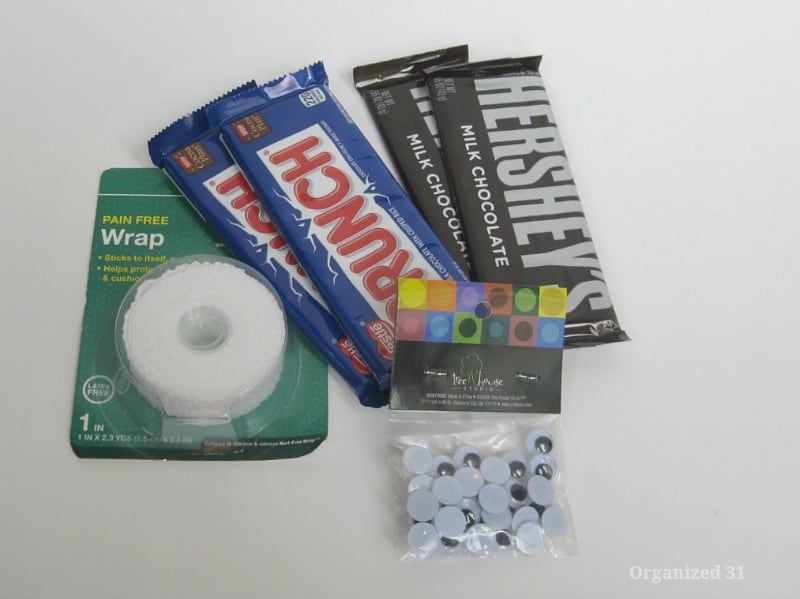 4 candy bars, bag of googly eyes and roll of gauze tape