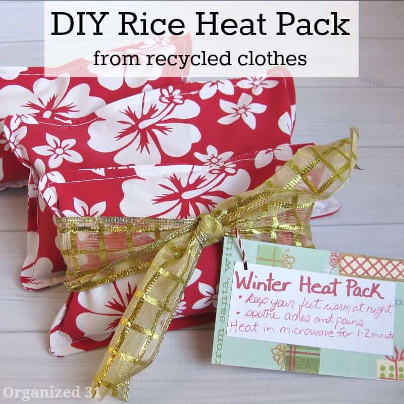 red and white floral rice pack with gold bow and gift tag on white wood table with title text overlay reading DIY Rice Heat Pack from recycled clothes