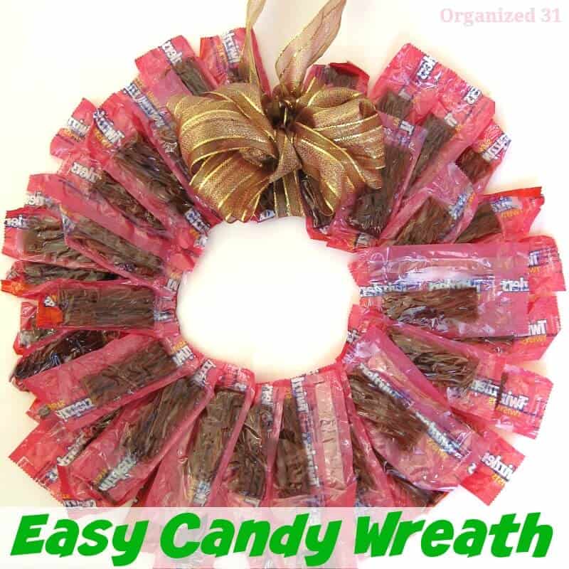wreath made from red wrapped candy with title text reading Easy Candy Wreath