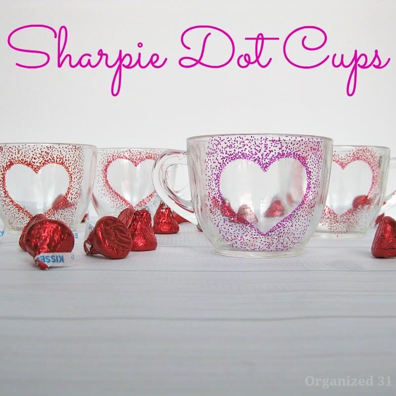 clear coffee cups with dotted heart designs in red and pink.