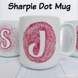 white coffee mug with red dot monogram 