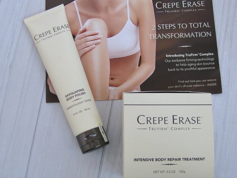 cream colored box with black text "Crepe Erase" and cream tube with black text "Crepe Erase" on white wood table with informational pamphlet with woman with bare arms and legs