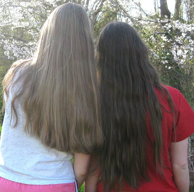 2 girls viewed from back with waist length hair
