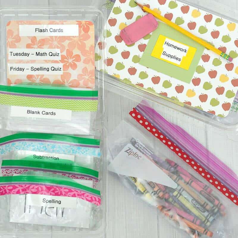 clear plastic boxes and Ziploc bags labeled with different titles like flash cards and homework supplies.