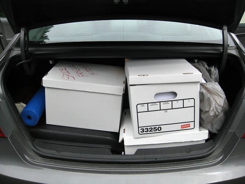 open trunk filled with moving boxes