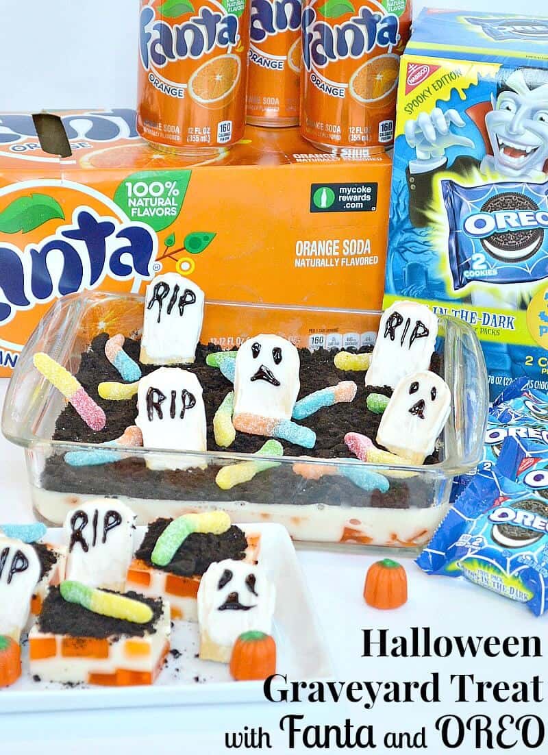 box of orange soda, package of Oreos, and tray of dessert that looks like a graveyard.