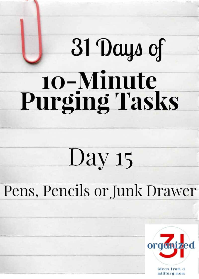 Notebook paper with a large paperclip and text reading 31 Days of 10-Minute Purging Tasks Day 15 Pens, Pencils or Junk Drawer