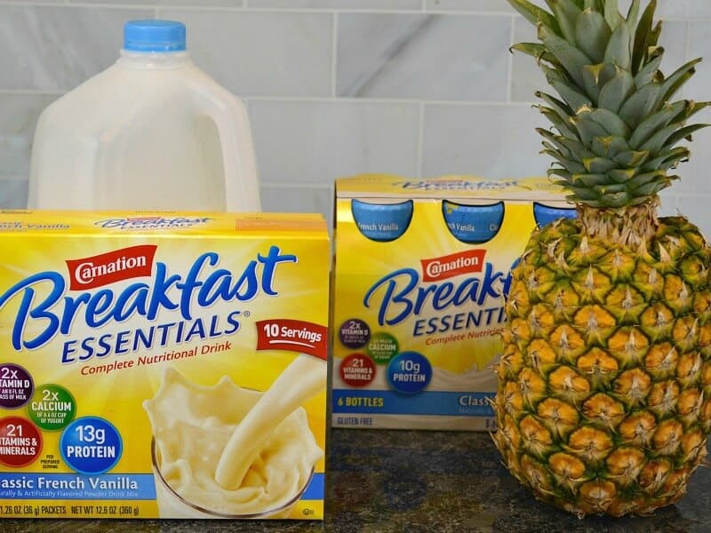milk jug, pineapple and box and bottles of breakfast drink