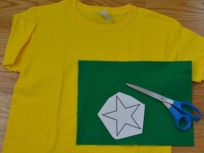 White star pattern on green felt on top of yellow t-shirt