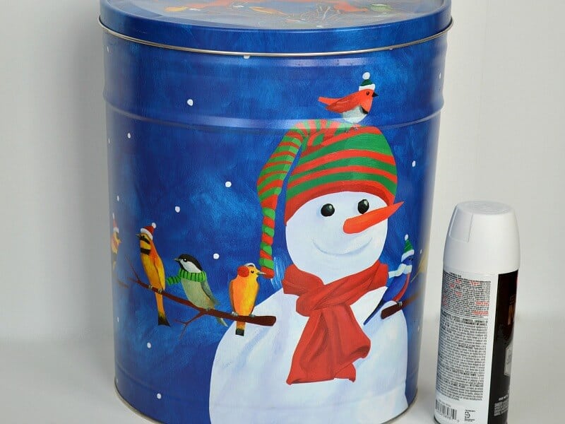 blue round popcorn tin with snowman