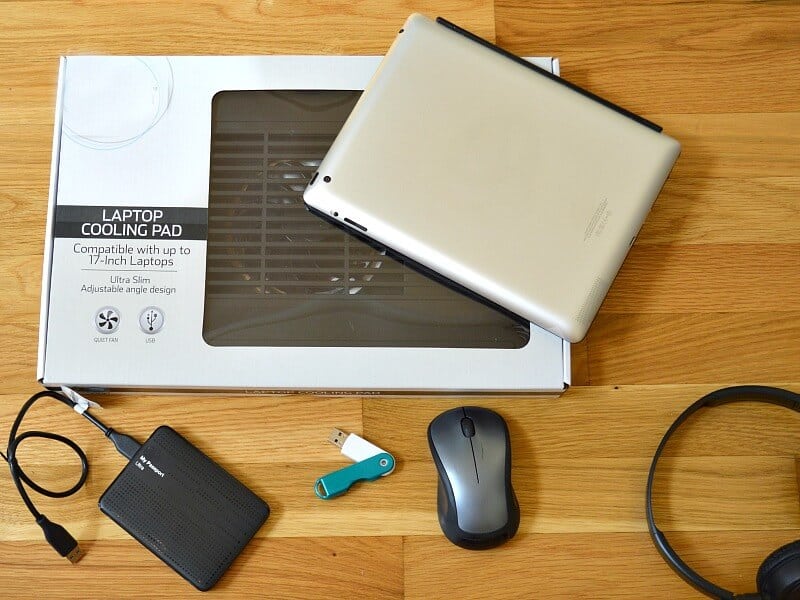 overhead view of computer accessories on wood table