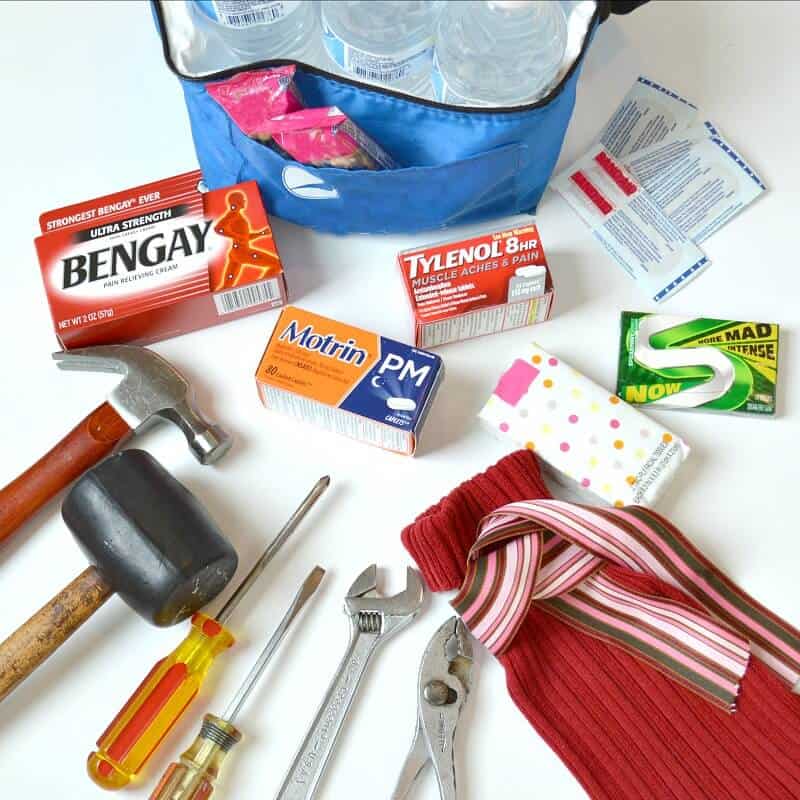 overhead view of tools and medication with red bag 