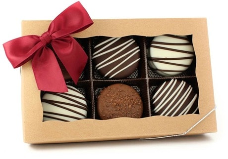 box of chocolate covered cookies with red bow