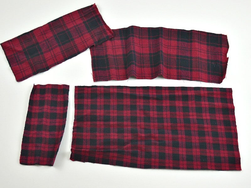 red and black plaid fabric rectangles on white table