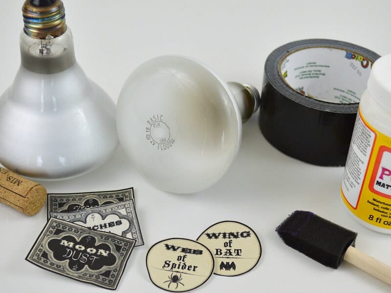 large lightbulbs, labels, sponge brush, jar of Mod Podge and black tape