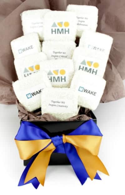 gift basket of logo cookies with blue and gold ribbon