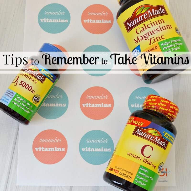bottles of vitamins scattered on top of reminder stickers with title text overlay reading Tips to Remember to Take Vitamins