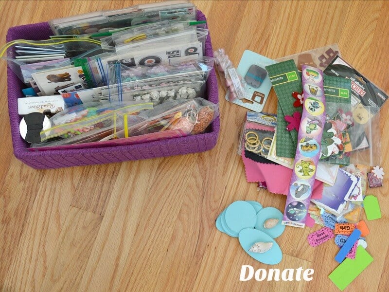 box of filed stickers and pile next to it on the table with text reading Donate
