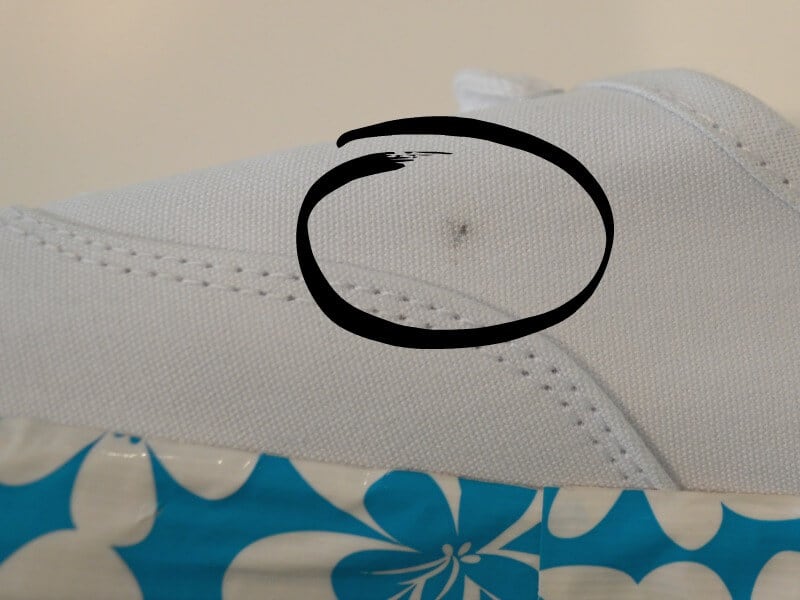 closeup of tennis shoe with circle overlay