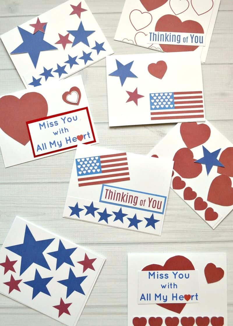 overhead view of red, white and blue cards with images of hearts, starts and flags