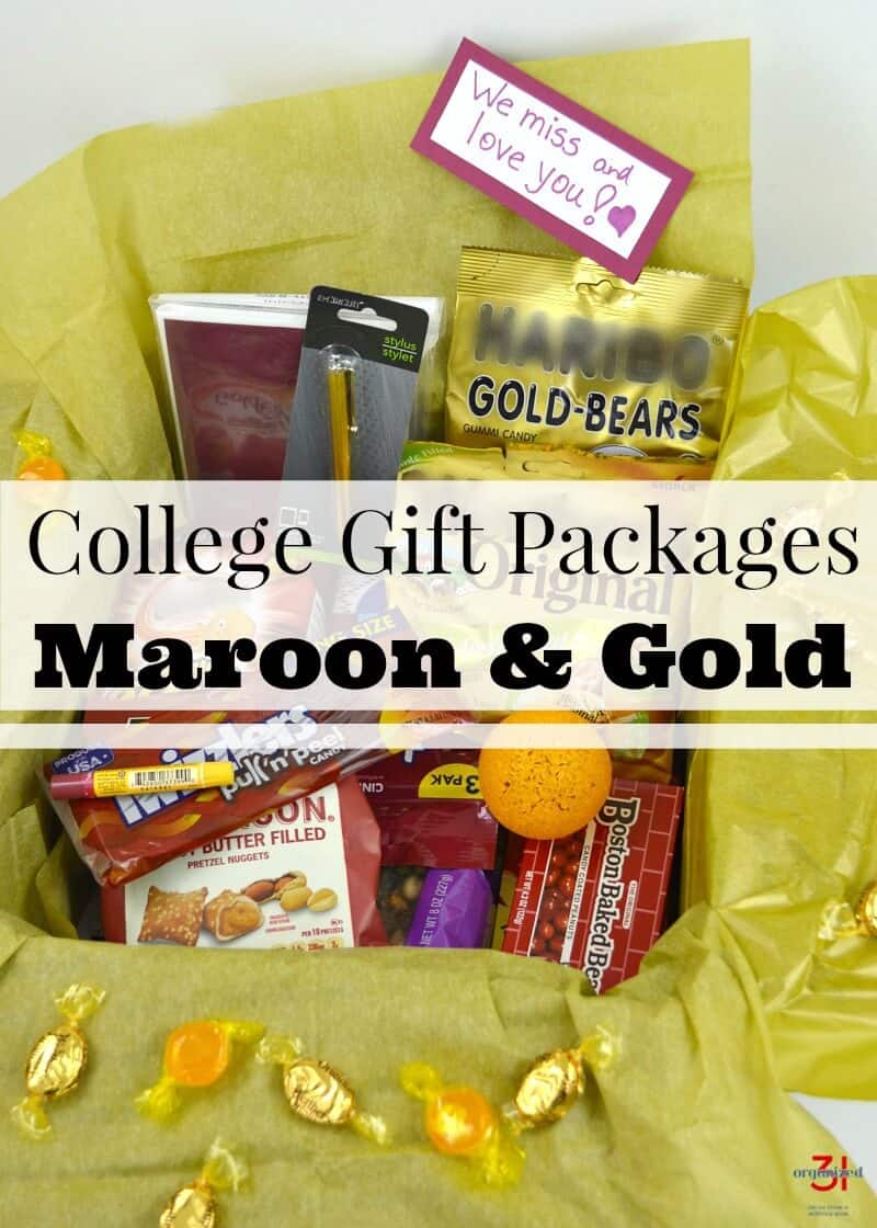  open shipping box with gold tissue paper and filled with maroon and gold items with title text reading College Gift Packages Maroon and Gold