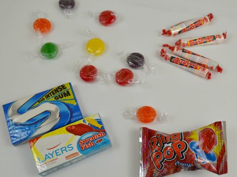 gum and candy on white table.