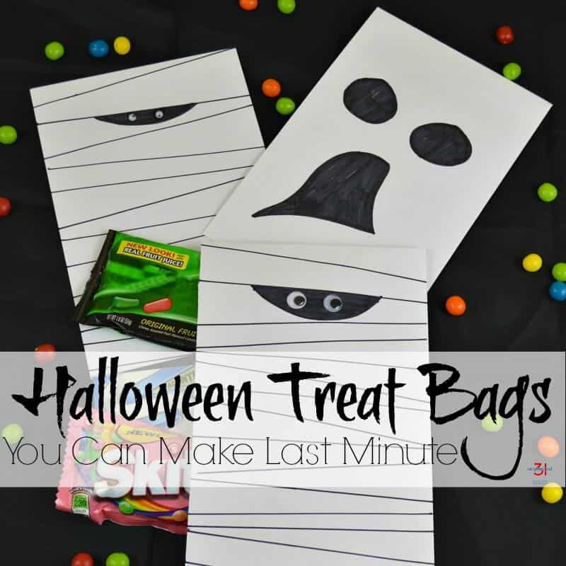 3 white bags decorated to look like mummies and a ghost on black background with colorful beads scattered around with title text overlay reading Halloween Treat Bags You  Can Make Last Minute