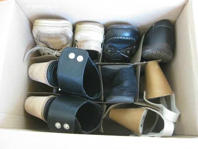 overhead view of shoes organized in box with divider
