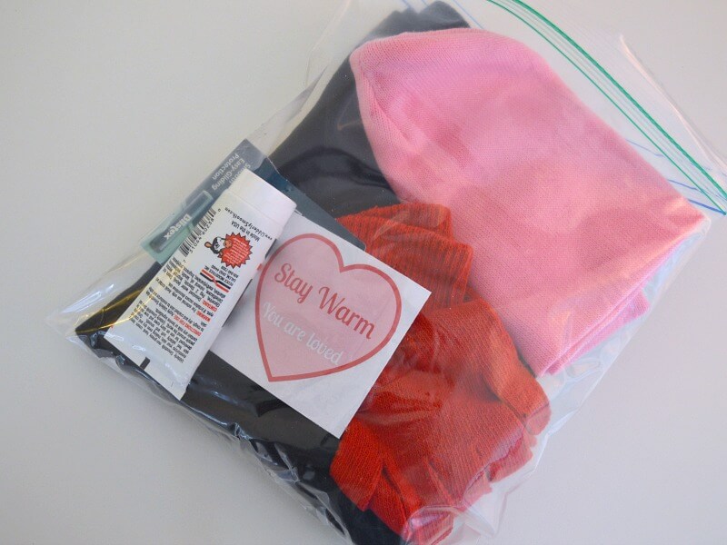 Plastic bag with warm weather supplies and heart card