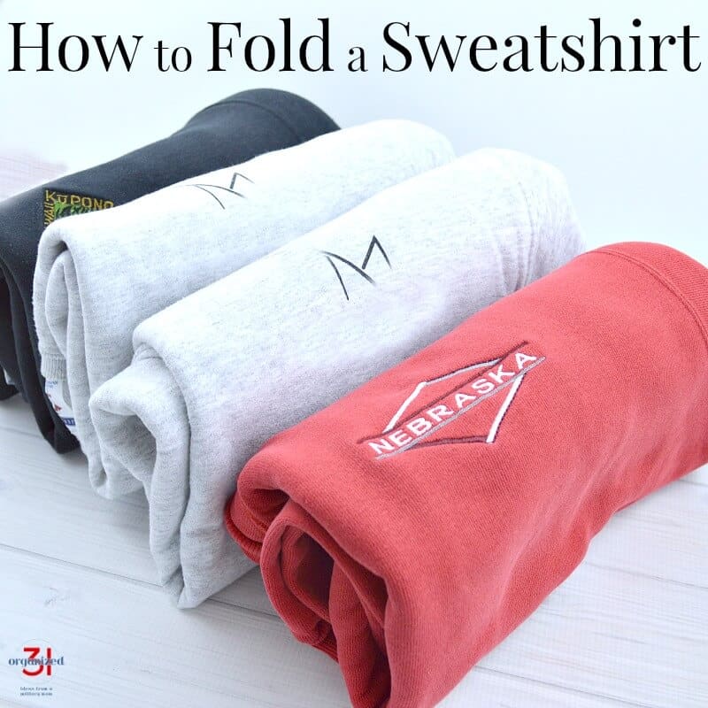 4 file folded sweatshirts standing up in row