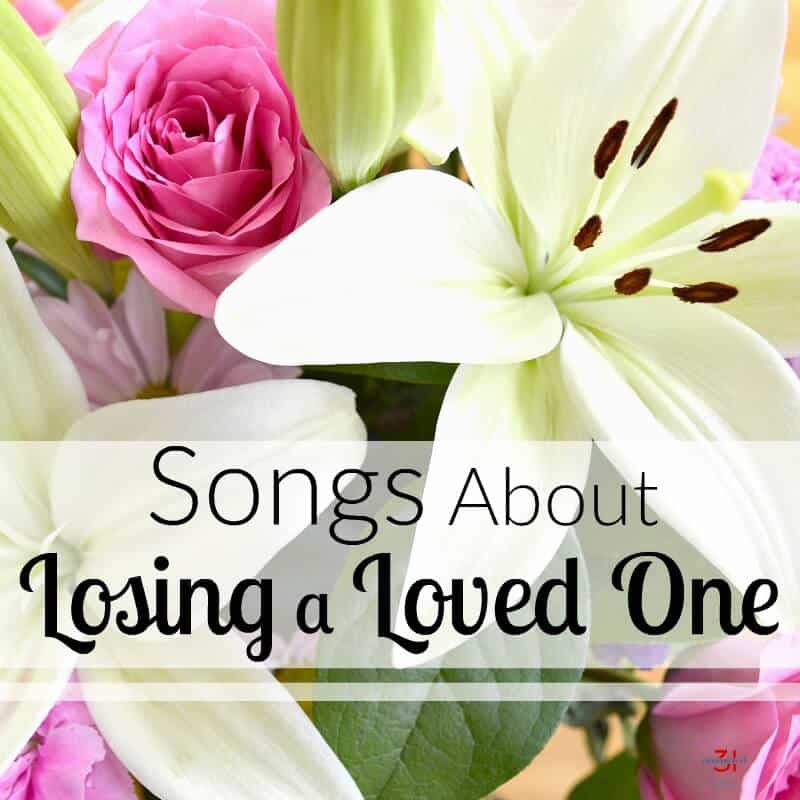 white and pink flowers in bouquet with text overlay reading Songs About Losing a Loved One.