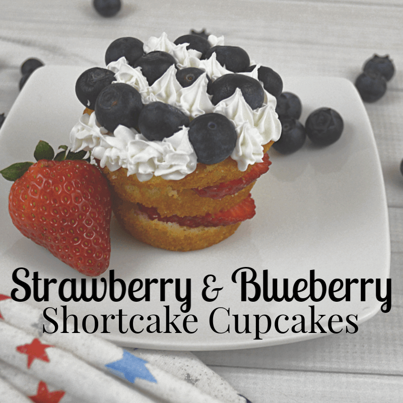 strawberry and blueberry shortcake with whip cream stars on white plate with text overlay