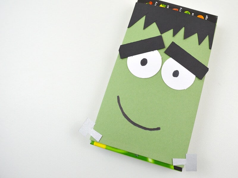 Close up of a Frankenstein paper craft candy wrapper.
