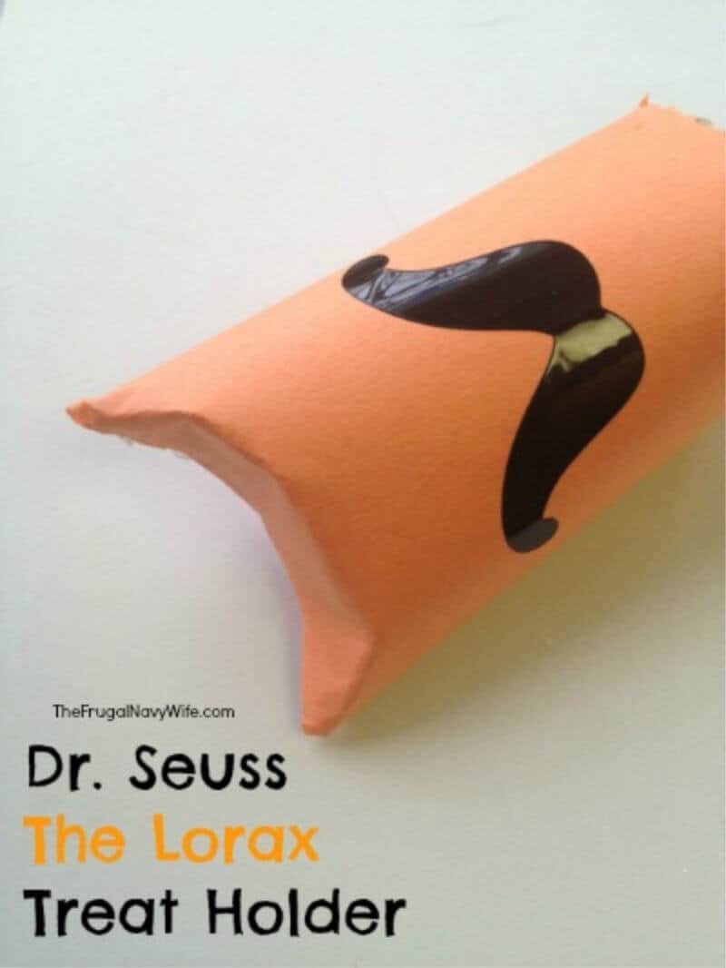 black mustache craft on orange background with Title text overlay reading Dr. Seuss The Lorax Treat Holder
