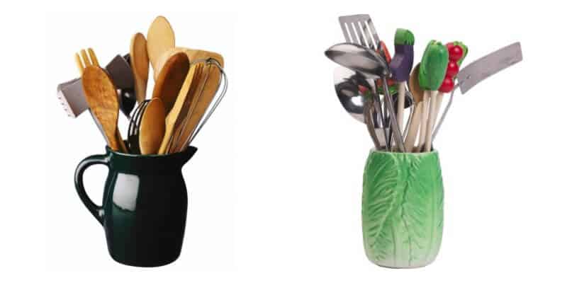 wooden kitchen utensils in black pitcher and silver utensils in green leaf vase