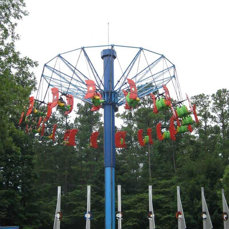 blue swing ride with red chairs