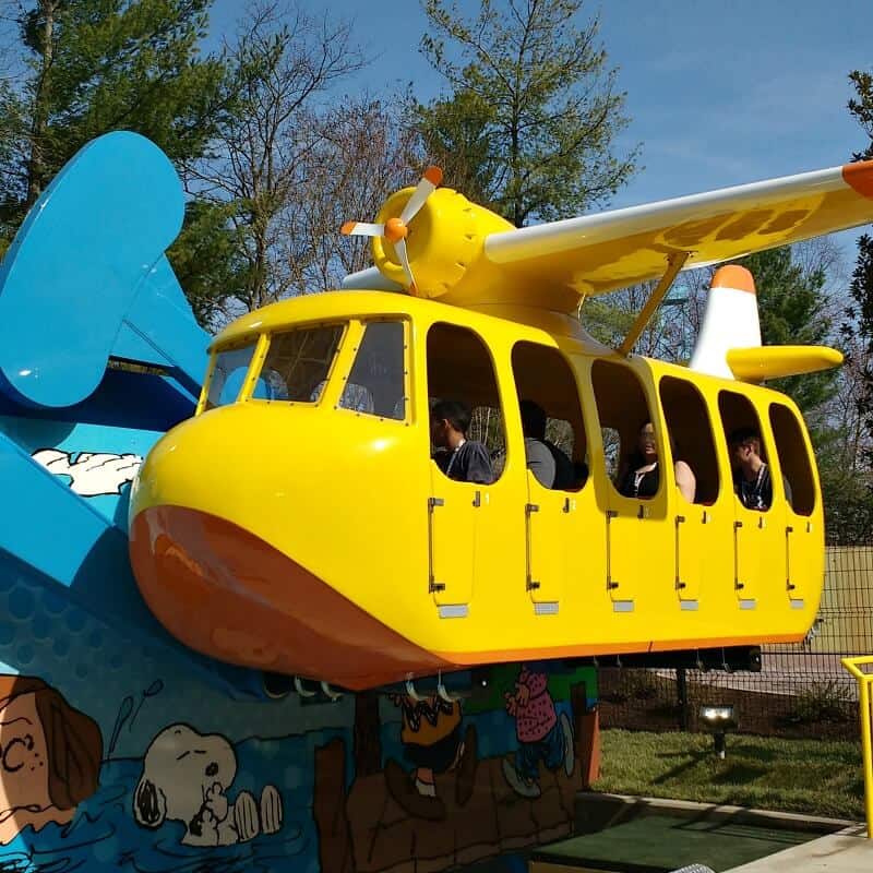 yellow amusement park airplane ride