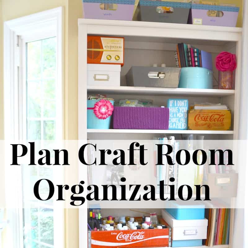 neatly organized and colorful white shelf with craft supplies.