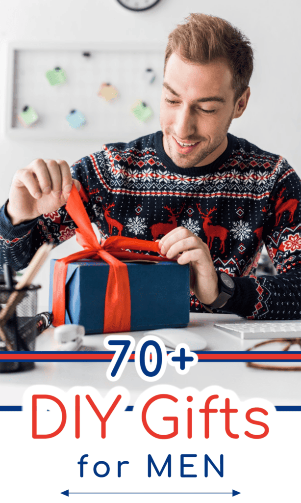 smiling man opening blue gift with red ribbon.