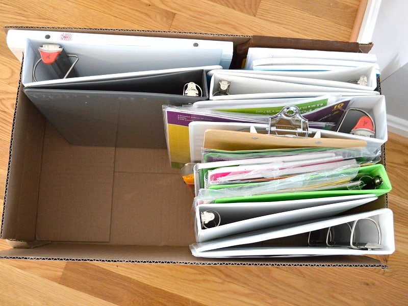 box of binders and office supplies