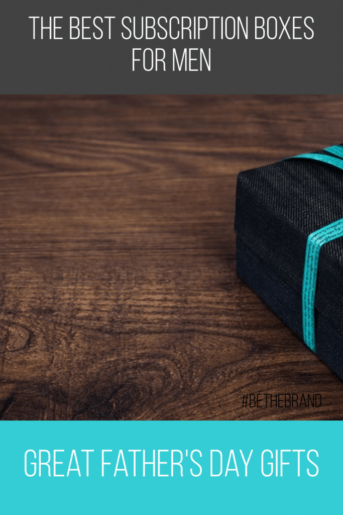 black box with turquoise ribbon on dark brown table with blue box overlay