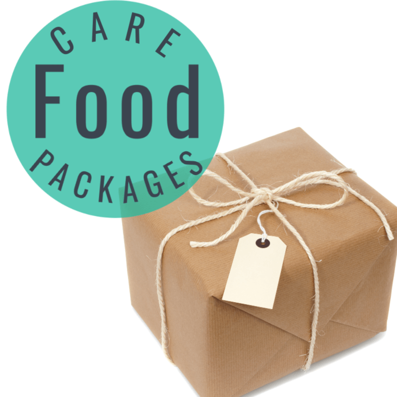 package wrapped in brown paper with twine bow & cream tag ,green circle with text