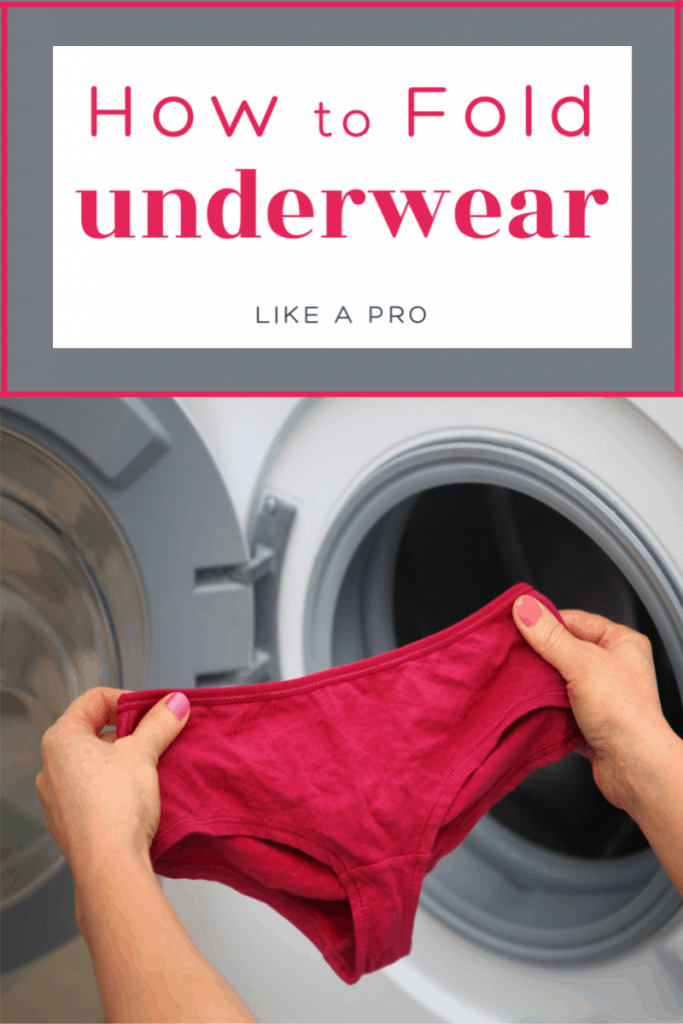 women's hands holding pair of underwear in front of open dryer